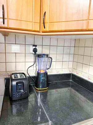 a blender and a toaster on a kitchen counter at Luxury 2-bedroom in Dubai Marina with Sea View in Dubai
