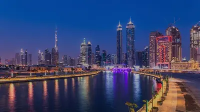 a view of a city with a river and buildings at C&L Homes Dubai Canal in Dubai
