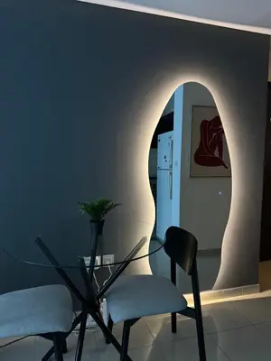 a room with two chairs and a table and a refrigerator at Modern Studio in Dubai Marina, JBR in Dubai