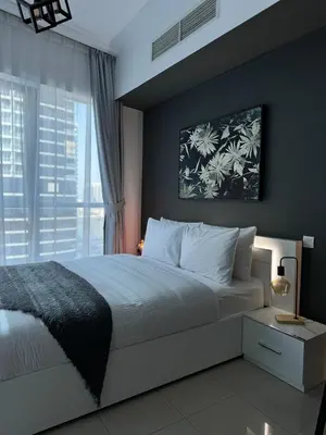 a bedroom with a large bed and a window at Modern Studio in Dubai Marina, JBR in Dubai
