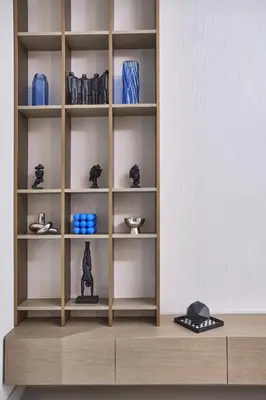 a shelf with vases and other items on it at Lux High-Rise Studio 12th Floor Westwood Grande in Dubai
