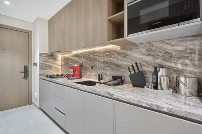 a kitchen with a sink and a counter top at Lux High-Rise Studio 12th Floor Westwood Grande in Dubai