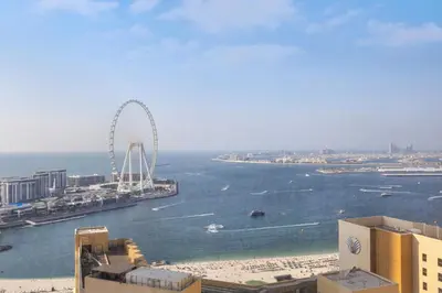 a view of a city with a ferris wheel in the water at Classy 2BR Apt in Shams1 Panoramic view in JBR in Dubai