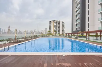 a large swimming pool on top of a building at Elegant Cozy Stu Luxury Stay 10 Min Dubai Mall in Dubai