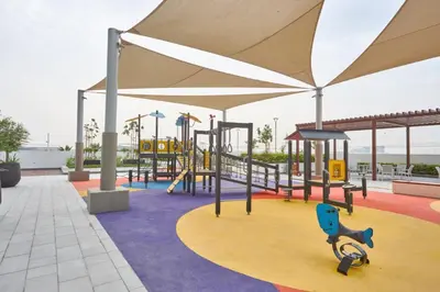 a playground with a play area with a slide at Elegant Cozy Stu Luxury Stay 10 Min Dubai Mall in Dubai