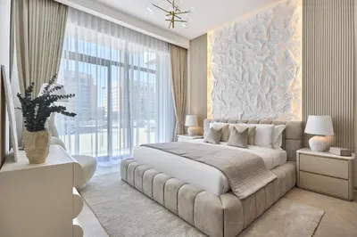 a bedroom with a large bed and a large window at Chic-1BROxford Terrace 2 Luxuriously Furnished in Dubai