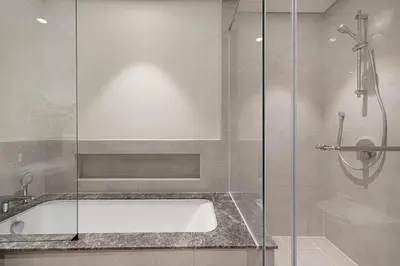 a bathroom with a bath tub and a shower at Luxury 4BR Prime Downtown Stay in Dubai