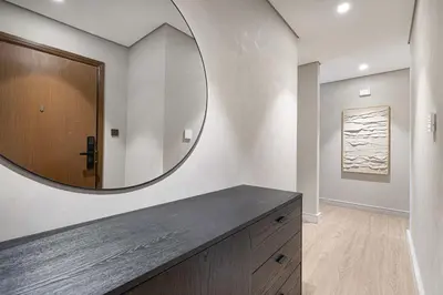 a bathroom with a large mirror on the wall at Luxury 4BR Prime Downtown Stay in Dubai