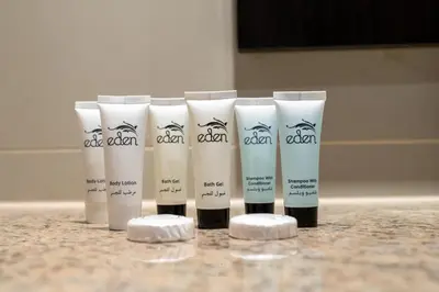 a group of four products sitting on a counter at Burj & Sea View King 2 Bedroom Apartment In Anantara Resort in Dubai