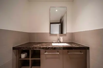 a bathroom with a sink and a mirror at Downtown Dubai Luxury 1 BR in BLVD Heights T1 in Dubai