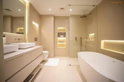 a bathroom with two sinks and a tub and a shower at Bnbeyond's Luxury Vibe & Burj View in Dubai