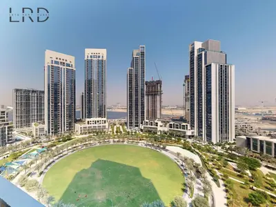 an aerial view of a city with tall buildings at Luxurious 1BR Apartment with Creek View in Dubai