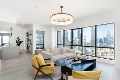 a living room with a couch and a table at South Ridge 1, Downtown Dubai - Mint Stay in Dubai