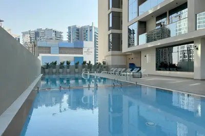 a swimming pool in the middle of a building at Premium Apartment, Right Infront of Canal in Dubai