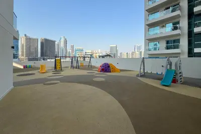 a playground in a building with a view of a city at Partial Canal View, Business Bay in Dubai
