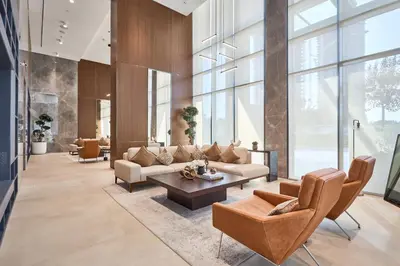 a living room with couches and a table at STAY BY LATINEM Luxury 1BR Holiday Home CVG 1410 Near Burj Khalifa in Dubai