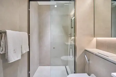 a bathroom with a shower and a toilet and a sink at STAY BY LATINEM Luxury 1BR Holiday Home CVG 1410 Near Burj Khalifa in Dubai