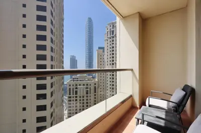 a balcony with two chairs and a view of the city at Livbnb-Serene 2B with Marina and Sea View Walk to Beach in Dubai