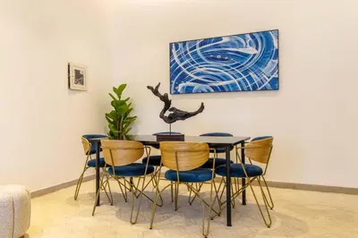 a dining room with a table and chairs at Luxurious 2Bed in Sparkle Tower-Marina View in Dubai