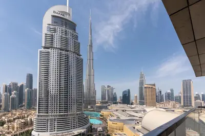 a view of the burj khalifa and the city at King 2BR With Burj Khalifa View In Boulevard Point in Dubai