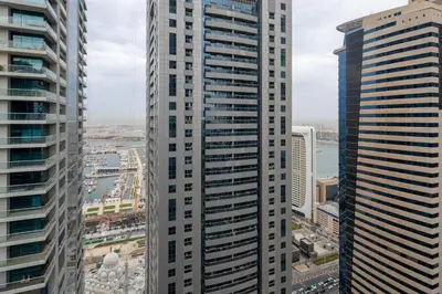 a view of two tall buildings in a city at Frank Porter - Torch Tower in Dubai
