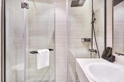 a bathroom with a shower and a sink at Two Bedroom Apartment in Nobles Tower by The S Holiday Homes in Dubai