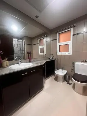 a bathroom with a sink and a toilet in it at New 1BED Apartment in Remraam, Dubai Land, Motor city, Damac hills, Mudoon area in Dubai