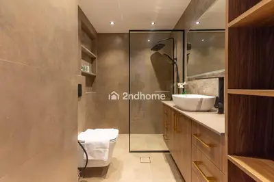 a bathroom with a toilet and a sink and a shower at Stylish 2Bedroom in DIFC Dubai Newly Furnished in Dubai