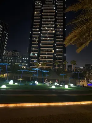 a city skyline at night with a tall building at Sparkle Towers by Swarovski - Dubai Marina - High Floor - Beach Resort Sunset view in Dubai