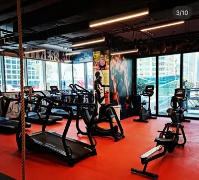 a gym with treadmills and elliptical machines at ZenStay - Haven of tranquility and luxury in Dubai