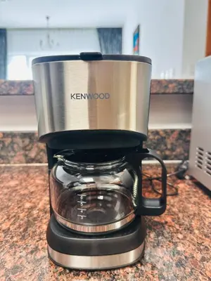 a kenwood coffee maker sitting on a counter at Airvistas Elevate Living 1BHK in Dubai