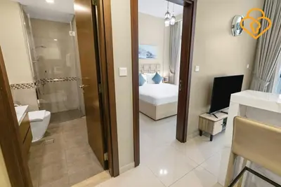 a bathroom with a bedroom with a bed and a shower at Keysplease 1 BR Apt, Vera Residence Business Bay in Dubai