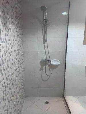 a shower stall in a bathroom with a sink at Spacious 1BR Apartment with Balcony in JVC - JLiving in Dubai