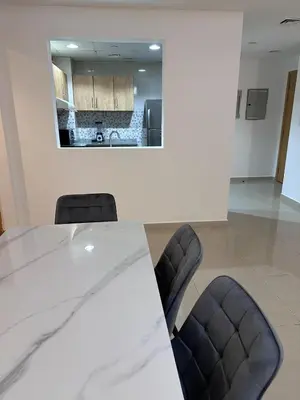 a conference room with a white table and chairs at Large 1BR Apartment with Balcony in JVC - JLiving in Dubai