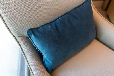 a blue pillow sitting on top of a couch at Damac Paramount Tower Burj Views in Dubai