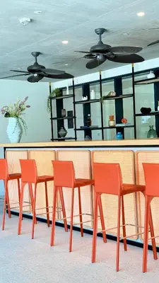 a table and four chairs in front of a counter at Brand New Golf View - Luxe Nest at Dubai Hills one bedroom apartment in Dubai