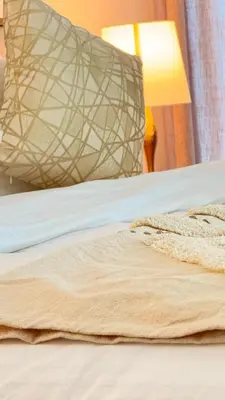a close up of a bed with a blanket on it at Brand New Golf View - Luxe Nest at Dubai Hills one bedroom apartment in Dubai