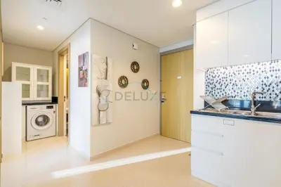 a kitchen with a sink and a washing machine at Close to Dubai Water Canal 1BR with Balcony, Aykon City 2 Tower C, Business Bay by Deluxe Holiday Homes in Dubai