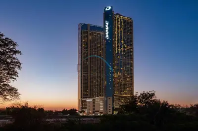 a tall building with a sign on the side of it at Close to Dubai Water Canal 1BR with Balcony, Aykon City 2 Tower C, Business Bay by Deluxe Holiday Homes in Dubai
