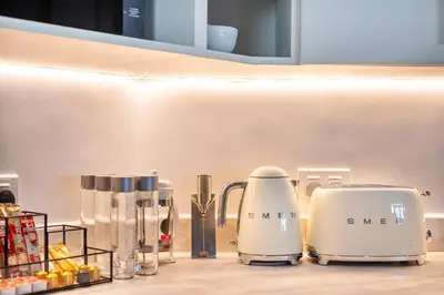 two toasters sitting on top of a kitchen counter at BURJ views Private Beach 2 Bedroom Apartment with panoramic Sea View and Pool Palm Jumeirah in Dubai
