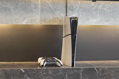 a video game controller sitting on a counter next to a vase at Luxury 1-Bedroom, High-Floor, Skyline Views in Dubai