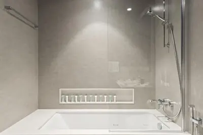 a bathroom with a bath tub and a shower at Luxury 1-Bedroom, High-Floor, Skyline Views in Dubai