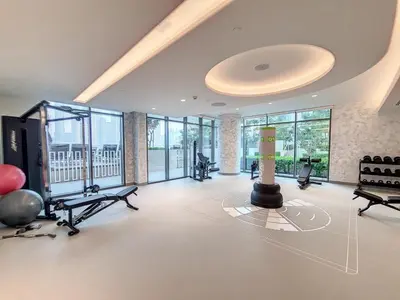 a gym with several treadmills and exercise equipment at Marina Vista - Airy One Bedroom in Dubai Marina in Dubai