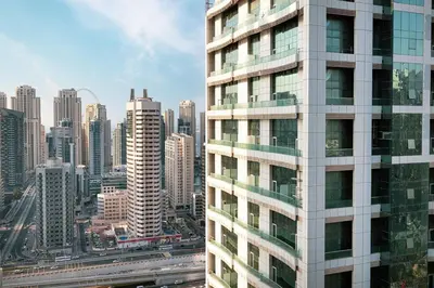 a view of a tall building in a city at Lake View Studio near Marina with Pool, Sauna and Gym in Dubai