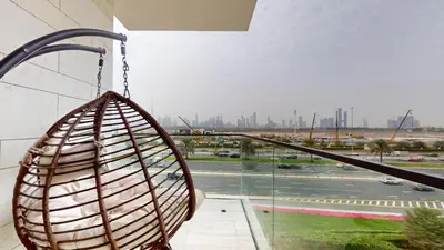 a basket swing hanging from a building at O Ten - Classy One Bedroom in Al Jaddaf in Dubai