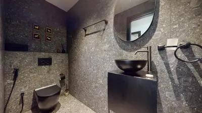 a bathroom with a sink and a mirror at O Ten - Classy One Bedroom in Al Jaddaf in Dubai