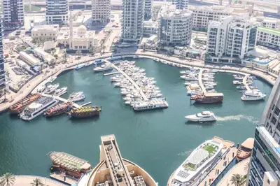 a harbor filled with lots of boats in a city at Livbnb - Spacious 2B in Shams with Marina View Walk to Beach in Dubai