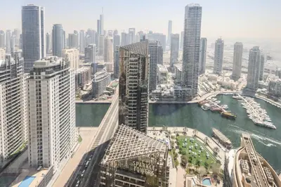an aerial view of a city with a river and buildings at Livbnb - Spacious 2B in Shams with Marina View Walk to Beach in Dubai