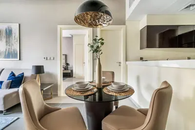 a living room with a table and chairs at GuestReady - Luxe Comfort in Bussiness Bay in Dubai