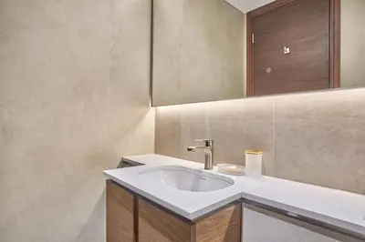 a bathroom with a sink and a mirror at STAY BY LATINEM Luxury 1BR Holiday Home CVG 2409 Near Burj Khalifa in Dubai
